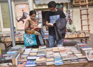 People busy in selecting and purchasing old books from roadside setup in Provincial Capital