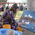 Artist giving final touches to the painting in Deewane Aam Painting Competition at Shahi Fort