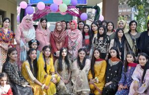 Assistant Commissioner Cantt Qandeel Fatima and Principal Maimoona Yasmeen in a group photo with students on the occasion of fun fair held at Associate College Railway Road. 