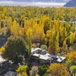 An attractive and eye catching view of leaves of tree changing colors around the Shigar Fort to mark autumn