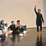 Children performing a drama titled "Diya Jalaye Rakhna" at Al-Hamra Arts Council