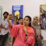Visitor capturing the moments through cell phone during “Jashan-e-Maholiat” Art paintings for Environment Exhibition organized by Sindh Community Foundation (SCF) at Mehran Arts Council