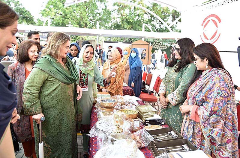 First Lady Begum Samina Alvi visiting stalls featuring traditional cuisines and arts and crafts of different countries at Pakistan Foreign Office Women's Association's Annual Charity Bazar