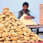 A vendor selling traditional sweetener jiggery (Gurr) at his roadside setup