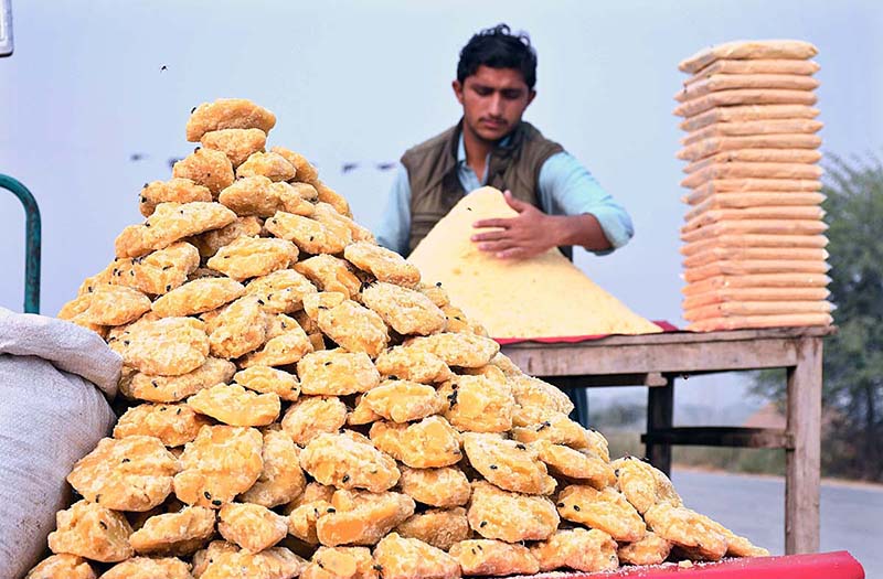 A vendor selling traditional sweetener jiggery (Gurr) at his roadside setup