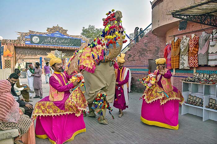 Artists performing traditional dance during “Folk Festival Lok Mela” at Lok Virsa.