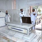 Pakistan Navy station Commander Lahore Commodore Sajjad Hussain offering dua after laying floral wreath during change of guard ceremony to mark the 146th birth anniversary of National Poet, Dr. Allama Muhammad Iqbal at Mazar-e-Iqbal