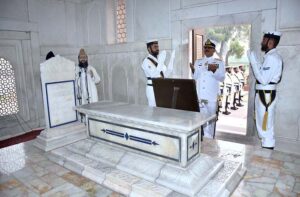 Pakistan Navy station Commander Lahore Commodore Sajjad Hussain offering dua after laying floral wreath during change of guard ceremony to mark the 146th birth anniversary of National Poet, Dr. Allama Muhammad Iqbal at Mazar-e-Iqbal