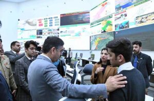 Caretaker Prime Minister Anwaar-ul-Haq Kakar interacting with team members and officers during his visit to National Emergency Operation Centre.