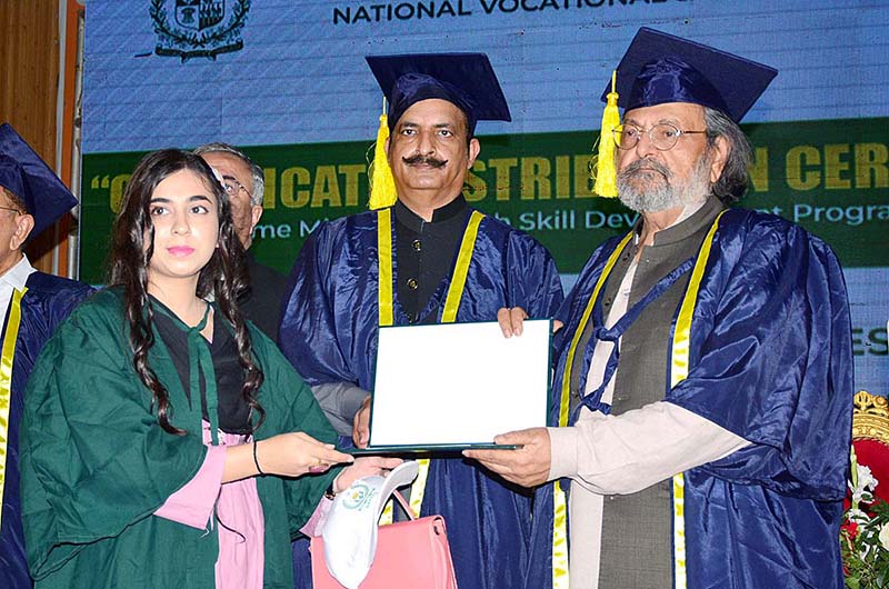 Caretaker Minister for Federal Education and Professional Training, Madad Ali Sindhi giving certificate to student during certificates distribution ceremony of Prime Minister Youth Skill Development Program Batch 04 NAVTTC at Sindh Museum