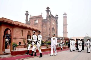 Pakistan Navy station Commander Lahore Commodore Sajjad Hussain offering dua after laying floral wreath during change of guard ceremony to mark the 146th birth anniversary of National Poet, Dr. Allama Muhammad Iqbal at Mazar-e-Iqbal