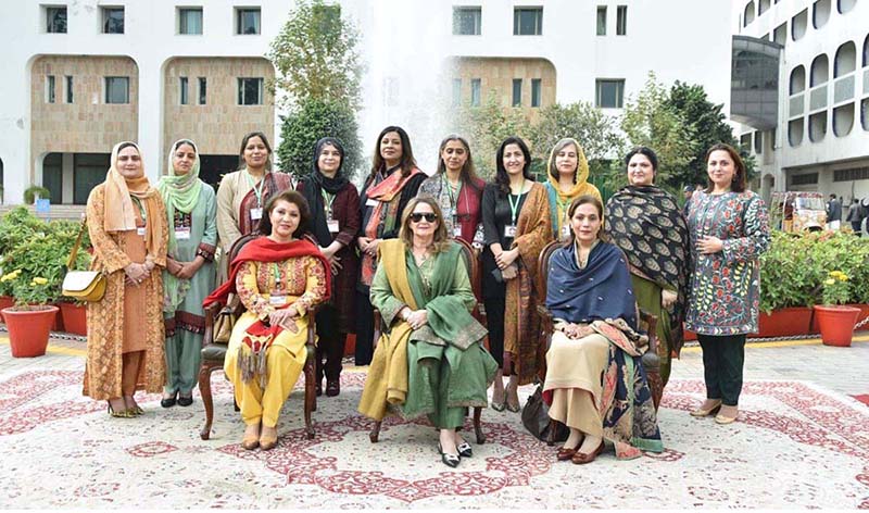 First Lady Begum Samina Alvi visiting stalls featuring traditional cuisines and arts and crafts of different countries at Pakistan Foreign Office Women's Association's Annual Charity Bazar