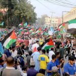 Jamat-e-Islami workers staging a rally against Israel’s brutality on the people of Palestine at Tilak Incline Road