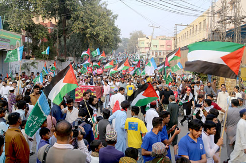 Jamat-e-Islami workers staging a rally against Israel’s brutality on the people of Palestine at Tilak Incline Road