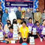 President Pakistan Olympic association Maqbool Arain, Principal FP School Eram Jafari, Principal Shah Latif Girls College Seema Perveen in a group photograph with the winning team players of Foundation Public School along with a trophy during the prize distribution ceremony of the 3rd Hyderabad Students Olympic Games 2023 at Shah Latif Girls College