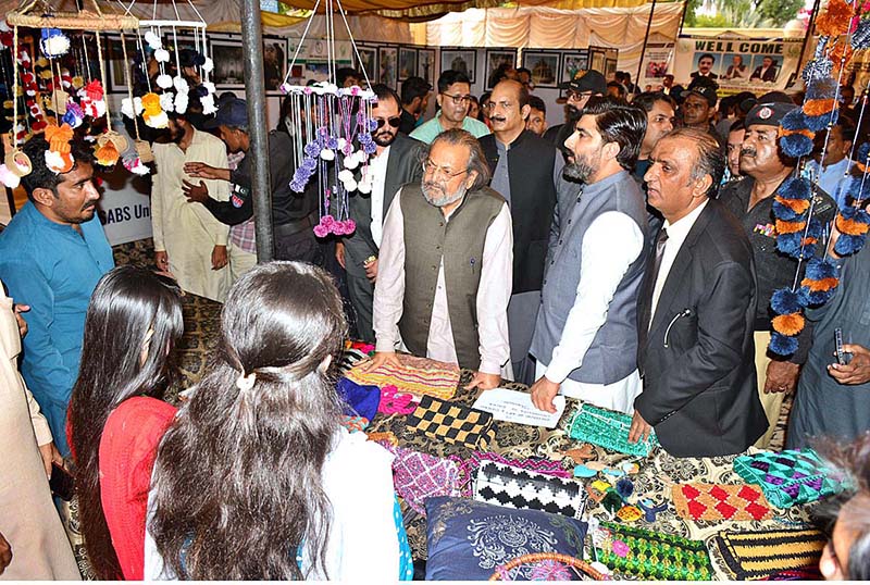 Caretaker Minister for Federal Education and Professional Training, Madad Ali Sindhi giving certificate to student during certificates distribution ceremony of Prime Minister Youth Skill Development Program Batch 04 NAVTTC at Sindh Museum
