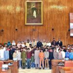 A group of students and faculty members of Government boys school Bhunat Islam Nagar, Bagh Azad Kashmir in the Senate Hall at Parliament House