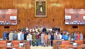 A group of students and faculty members of Government boys school Bhunat Islam Nagar, Bagh Azad Kashmir in the Senate Hall at Parliament House