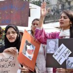 Women demonstrating in front of the press club against violence against women