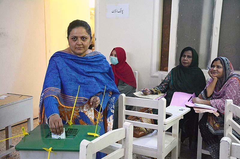 A female voter exercising her right to vote at a polling station in the metropolis during by-elections for direct Local Government (LG) seats
