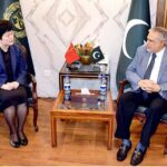 Leader of the house in the Senate, Senator Mohammad Ishaq Dar exchanging views with Charge' d Affairs, Embassy of the People's Republic of China, Ms. Pang Chunxue, at Parliament House.