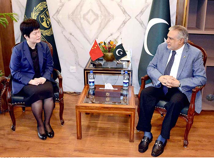 Leader of the house in the Senate, Senator Mohammad Ishaq Dar exchanging views with Charge' d Affairs, Embassy of the People's Republic of China, Ms. Pang Chunxue, at Parliament House.