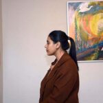 Visitor taking keen interest in the painting during seven days exhibition Off Grid Residency Creative Art by Geytee Ara at PNCA