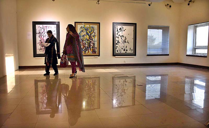 Visitor taking keen interest in the painting during seven days exhibition Off Grid Residency Creative Art by Geytee Ara at PNCA