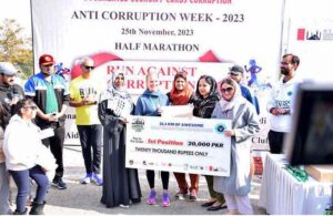 Winners receiving cheaque during prize distribution ceremony for Marathon Race organized by NAB Rawalpindi to commemorate Anti- Corruption Week