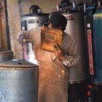 A worker busy in making gas geyser at Mian Mir Road