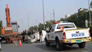 A view of damaged car due to accident in the Federal Capital at Jinnah Avenue.
