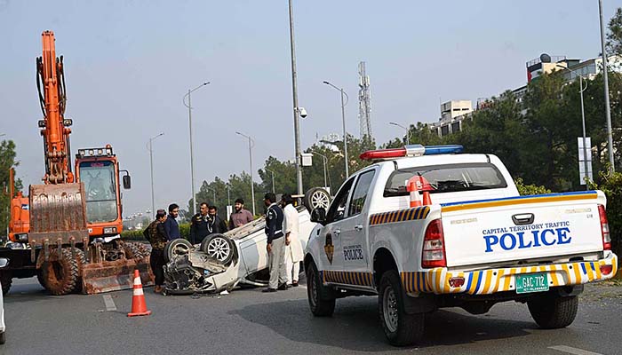 A view of damaged car due to accident in the Federal Capital at Jinnah Avenue.