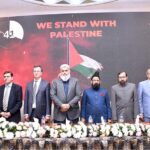 Vice Chancellor of LUMHS Dr. Ikaramudin Ujan with the delegation standing in support of the Palestinians on stage during the 36th international conference by Pakistan Society of Neurosurgeons in collaboration with Turkish Neurosurgical Society and Emirates Society of Neurosurgical Surgeons on last late night at LUMHS Jamshoro