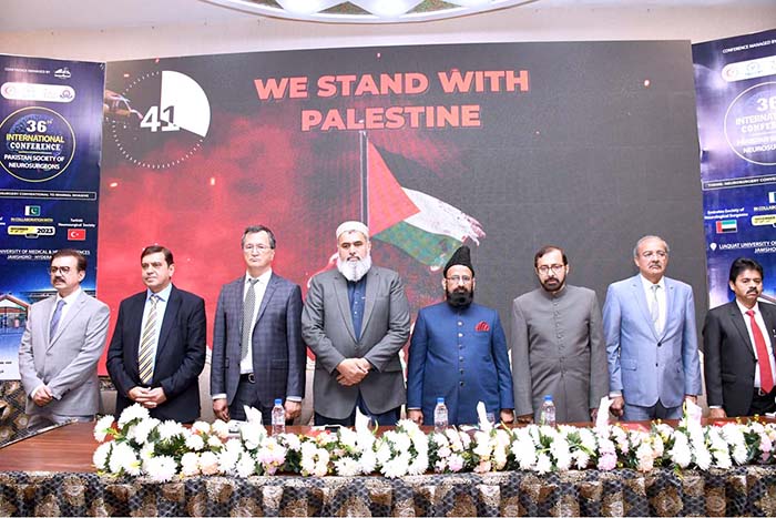 APP33-101123Hyderabad Vice Chancellor of LUMHS Dr. Ikaramudin Ujan with the delegation standing in support of the Palestinians on stage during the 36th international conference by Pakistan Society of Neurosurgeons in collaboration with Turkish Neurosurgical Society and Emirates Society of Neurosurgical Surgeons on last late night at LUMHS Jamshoro