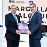 President of IPRI Dr. Raza Muhammad presents the book "Persecution of the Indian Minorities" to caretaker Prime Minister Anwaar-ul-Haq Kakar