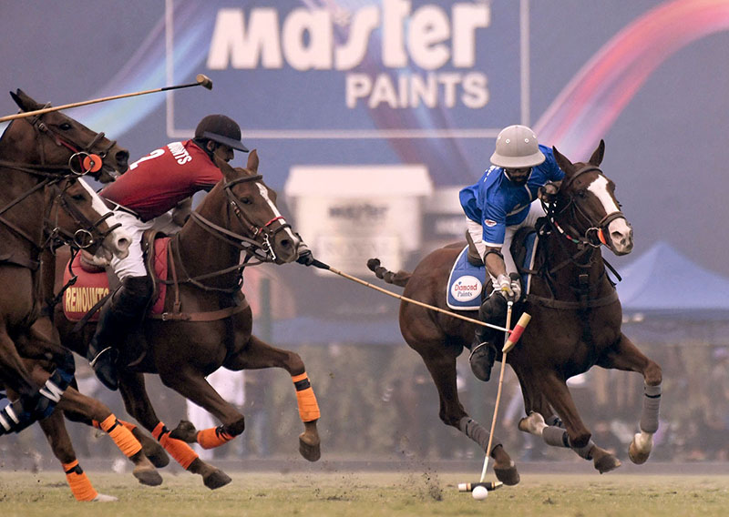 Players struggling to get hold on the ball during Final match between Diamond Paints VS Remounts for Patrons Aibak Polo Cup 2023 at Lahore Polo Club