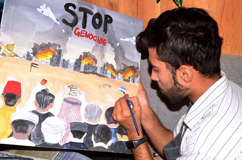 A student participating in Painting Competition in solidarity with Palestine organized by KICK Star