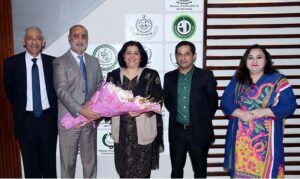 Shafqat Abbas Joint Secretary, Ministry of I&B presenting a bouquet to newly appointed Federal Secretary Information & Broadcasting Ms. Shahera Shahid upon her taking over charge of the office of the Secretary
