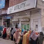 A lengthy line of women patiently waits for their turn to buy flour and ghee at subsidized rates from the Government at Katchery Road Utility Store