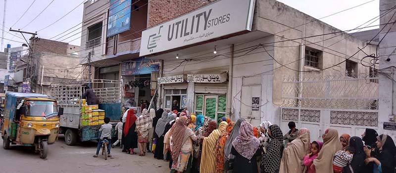 A lengthy line of women patiently waits for their turn to buy flour and ghee at subsidized rates from the Government at Katchery Road Utility Store