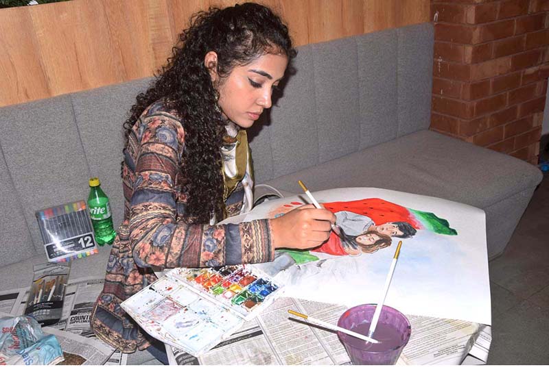 A student participating in Painting Competition in solidarity with Palestine organized by KICK Star