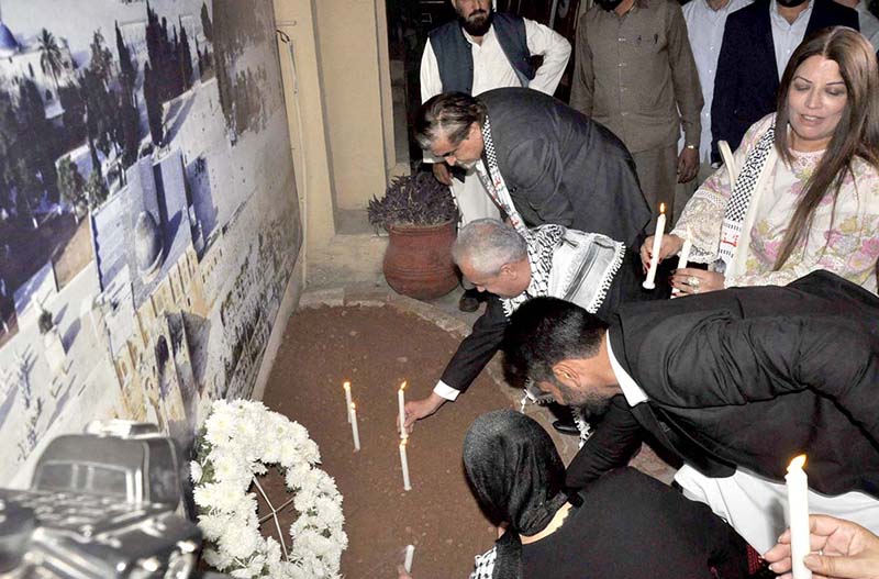 Caretaker Federal Minister for National Heritage and Culture, Jamal Shah along with Palestinian Ambassador in Pakistan, Ahmed Jawad Rabei lit candle light in memory of the Palestinian martyred people at the Palestinian stall at opening ceremony of "Annual Ten-Day Folk Festival Lok Mela at Lok Virsa