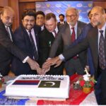 Governor Sindh Kamran Khan Tessori along with Caretaker Sindh Chief Minister Justice (R) Maqbool Baqar ,Consul General of Russian Federation Karachi, Andrey V. Fedorov and others Jointly Cutting Cake during People's Unity Day Ceremony at the Russian Consulate.