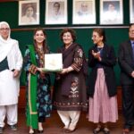 Chairperson National Commission on The Rights of Child Ayesha Raza Farooq presents a shield to Chief Guest Senator Nuzhat Sadiq.