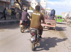 A police personnel on motorbike having no number plate and helmet at Chungi No. 9, is violation of law and question mark and needs special attention of the concerned authorities