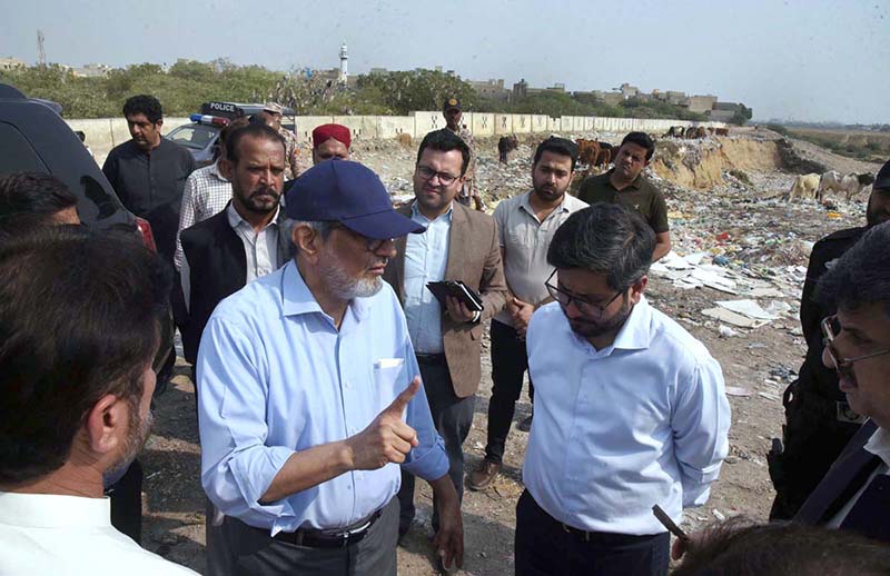 Caretaker Sindh Chief Minister Justice (R) Maqbool Baqar visits Azeempura Graveyard, Korangi where garbage is dumped illegally