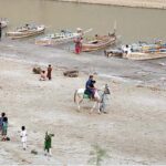 Families enjoying at bank of Indus River