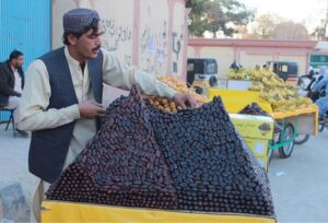 A vendor arranging dates for selling on his cart to attract costumers customers near Science College