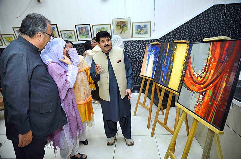Women taking keen interest in display stuff during an art exhibition at SBBWU