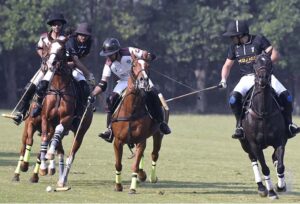 Players struggling to get hold on the ball during polo match between FG DIN Polo and Newage Cables Master Paints during Patrons 47th Aibak Cup 2023 at Lahore Polo Club. FD DIN polo team won the match by 8-4